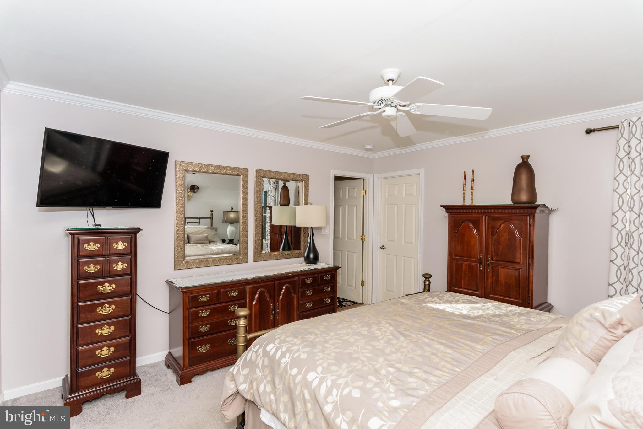 11 Drawbridge Road Berlin, MD 21811 - Photo 37 of 78 a bedroom with a bed and a flat screen tv