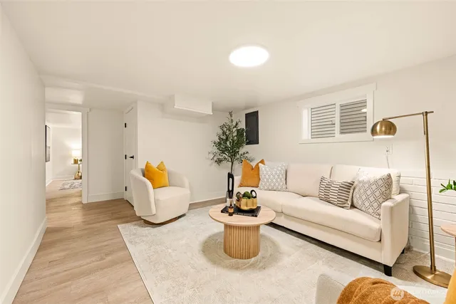 a view of a livingroom with furniture and wooden floor