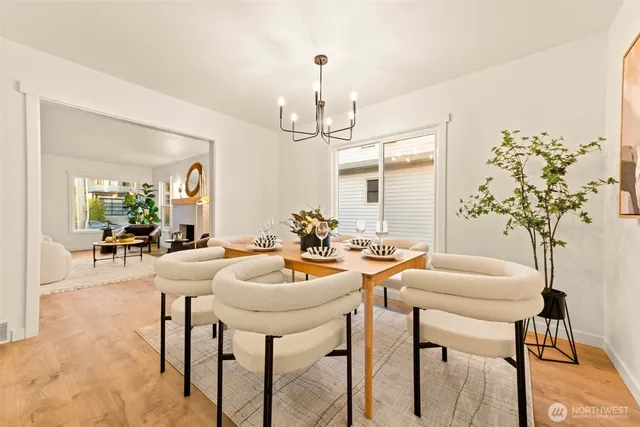 a kitchen with a refrigerator sink and white cabinets