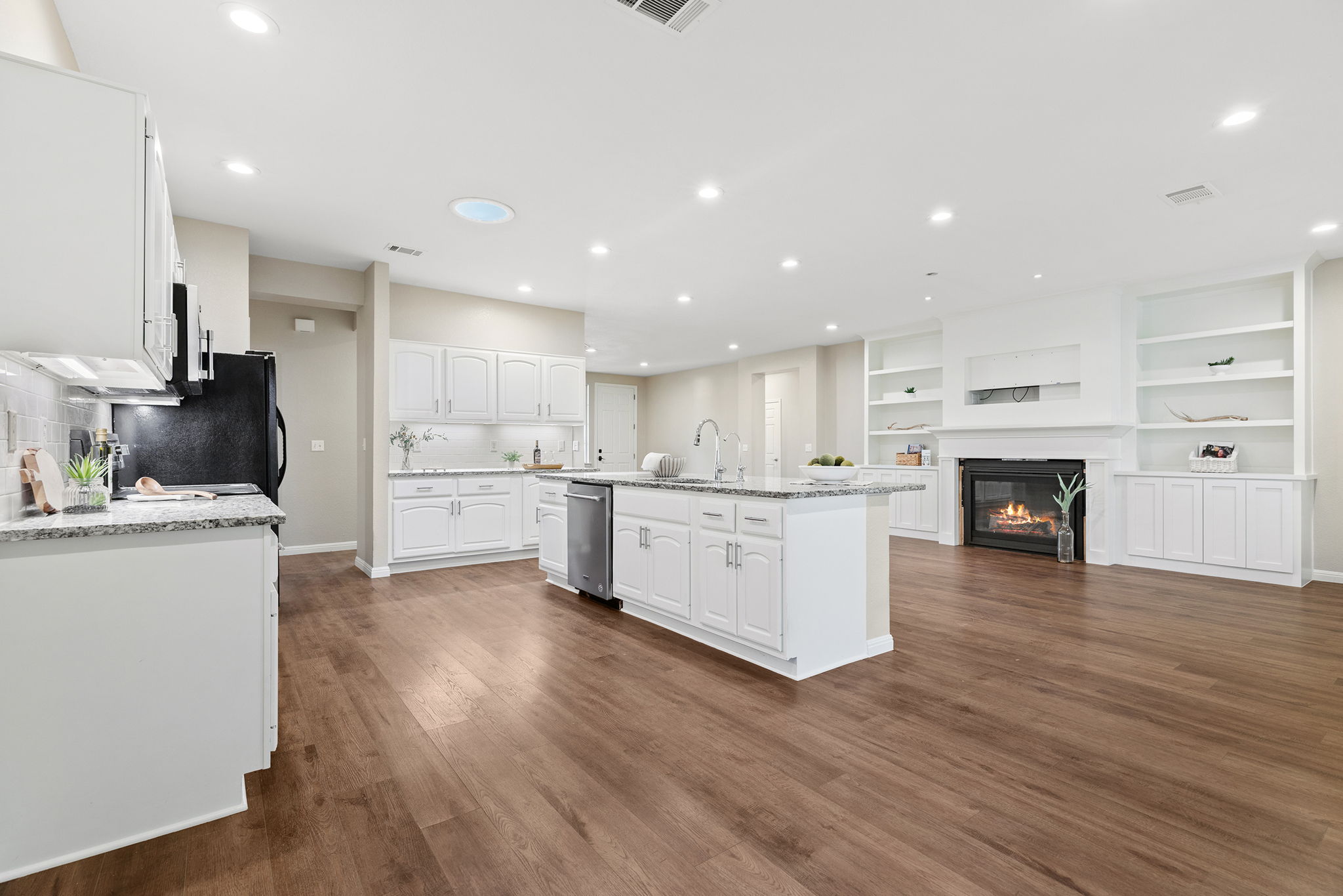 120 Ruellia Drive Georgetown, TX 78633 - Photo 38 of 39 Open floor plan with built-in cabinets surrounding fire place.