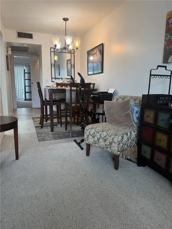 a view of a room that has a large window