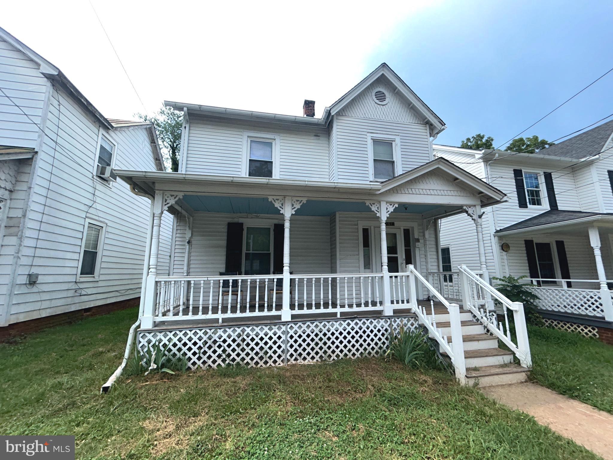 161 East Main Street Orange, VA 22960 - Photo 1 of 37 a front view of a house with a garden
