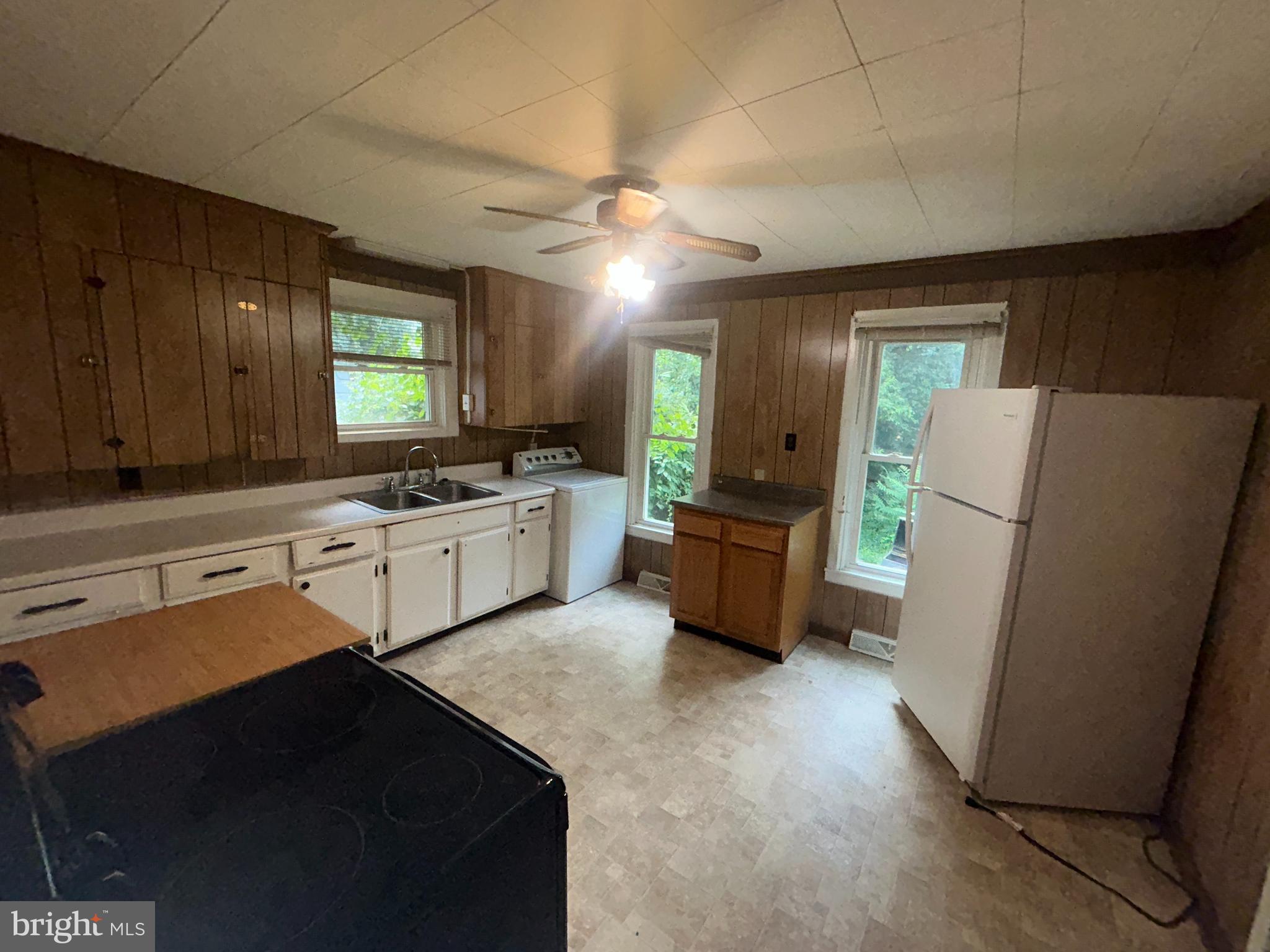 161 East Main Street Orange, VA 22960 - Photo 12 of 37 a kitchen with a refrigerator a sink and dishwasher
