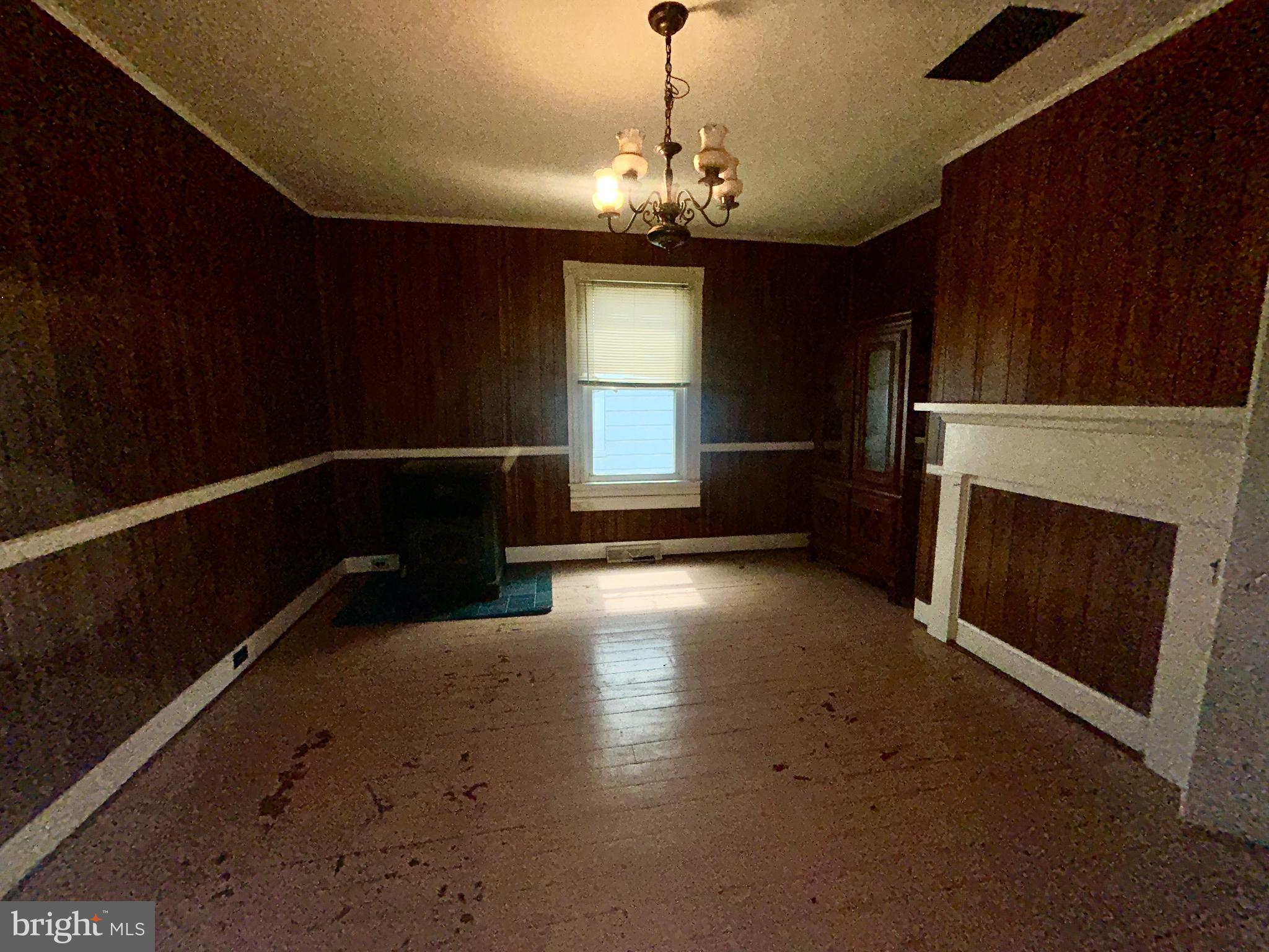 161 East Main Street Orange, VA 22960 - Photo 13 of 37 a view of a livingroom with wooden floor a fireplace and window