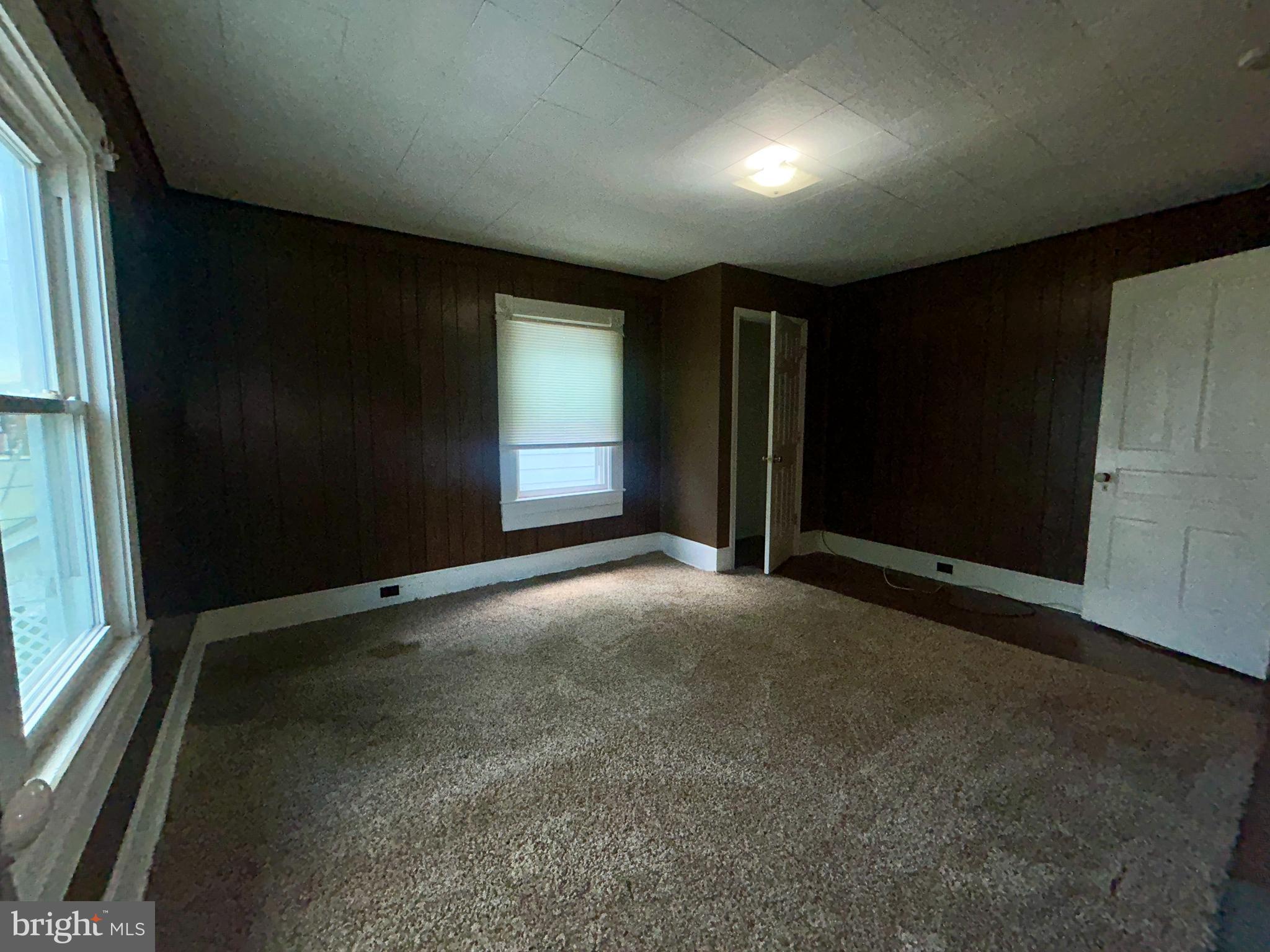 161 East Main Street Orange, VA 22960 - Photo 15 of 37 an empty room with windows
