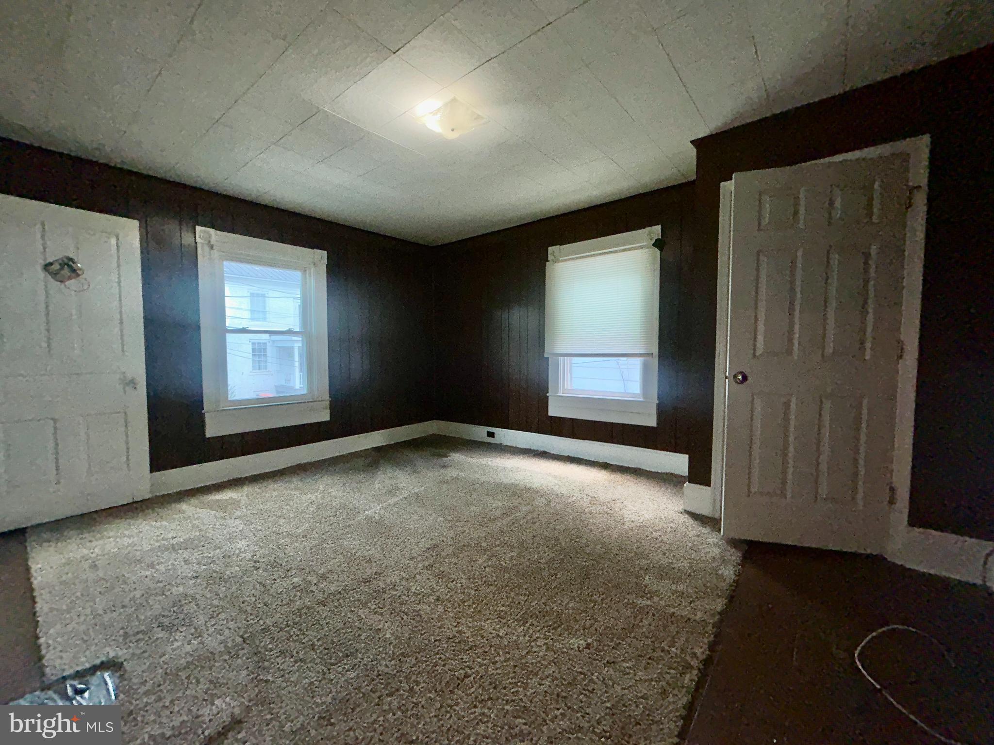 161 East Main Street Orange, VA 22960 - Photo 17 of 37 an empty room with windows