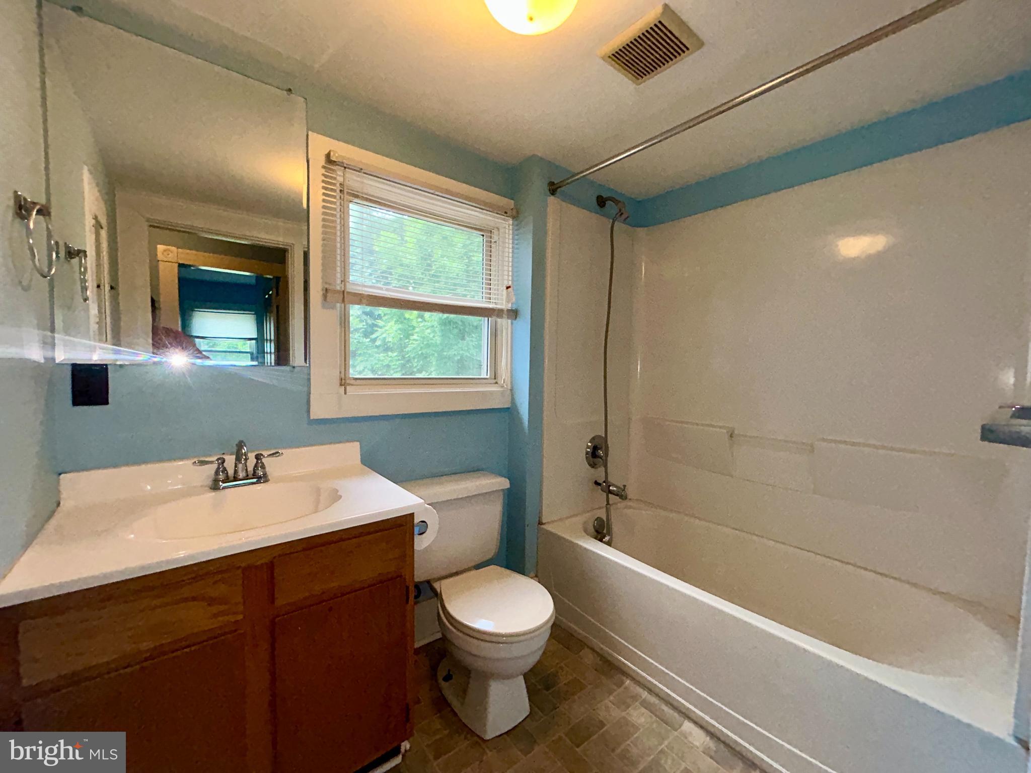 161 East Main Street Orange, VA 22960 - Photo 18 of 37 a bathroom with a sink a toilet and shower