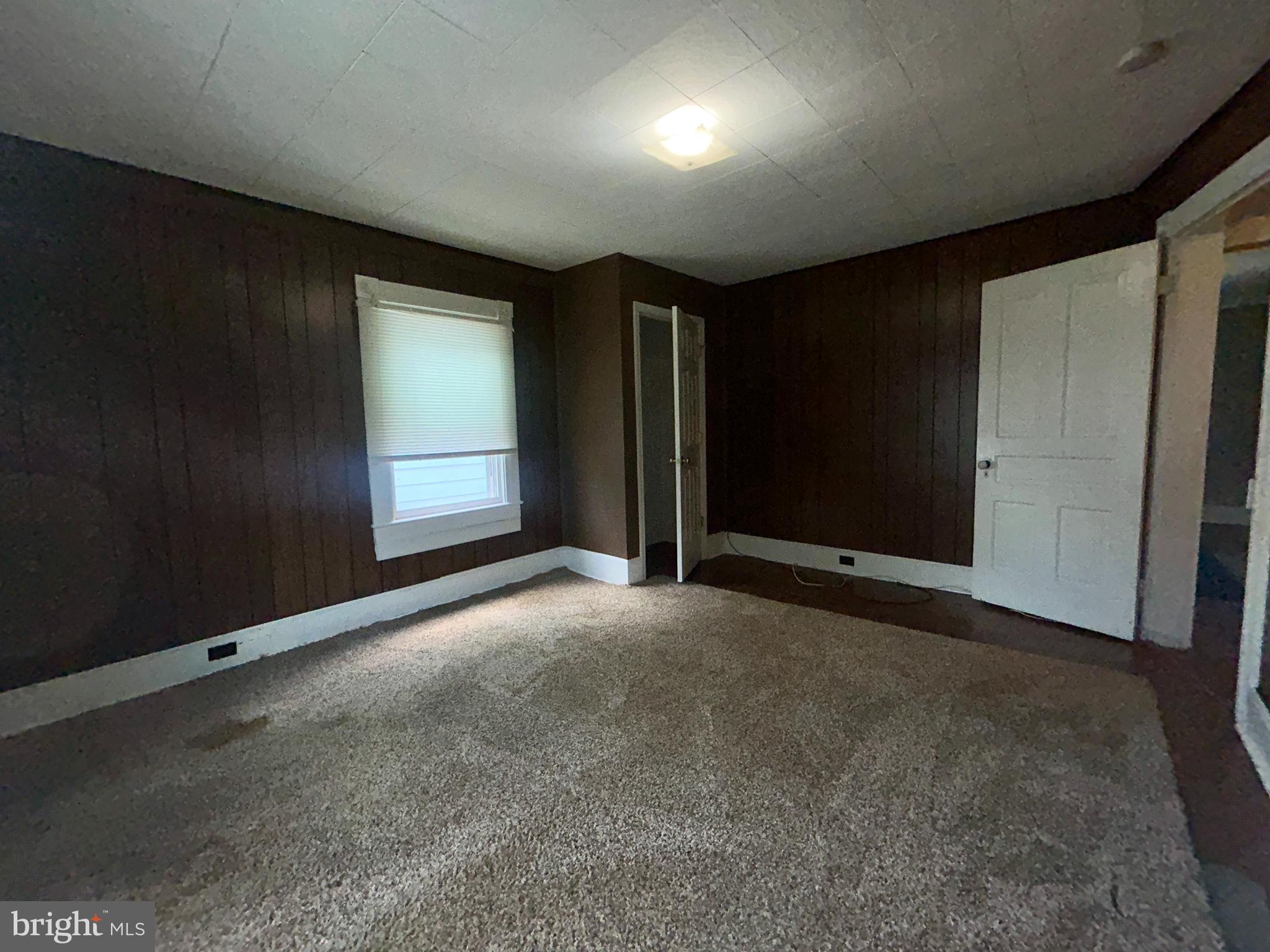 161 East Main Street Orange, VA 22960 - Photo 25 of 37 a view of an empty room with a window