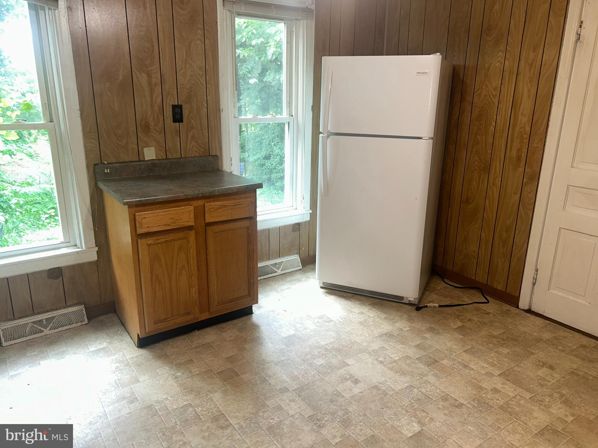 161 East Main Street Orange, VA 22960 - Photo 31 of 37 a view of a kitchen with refrigerator and window