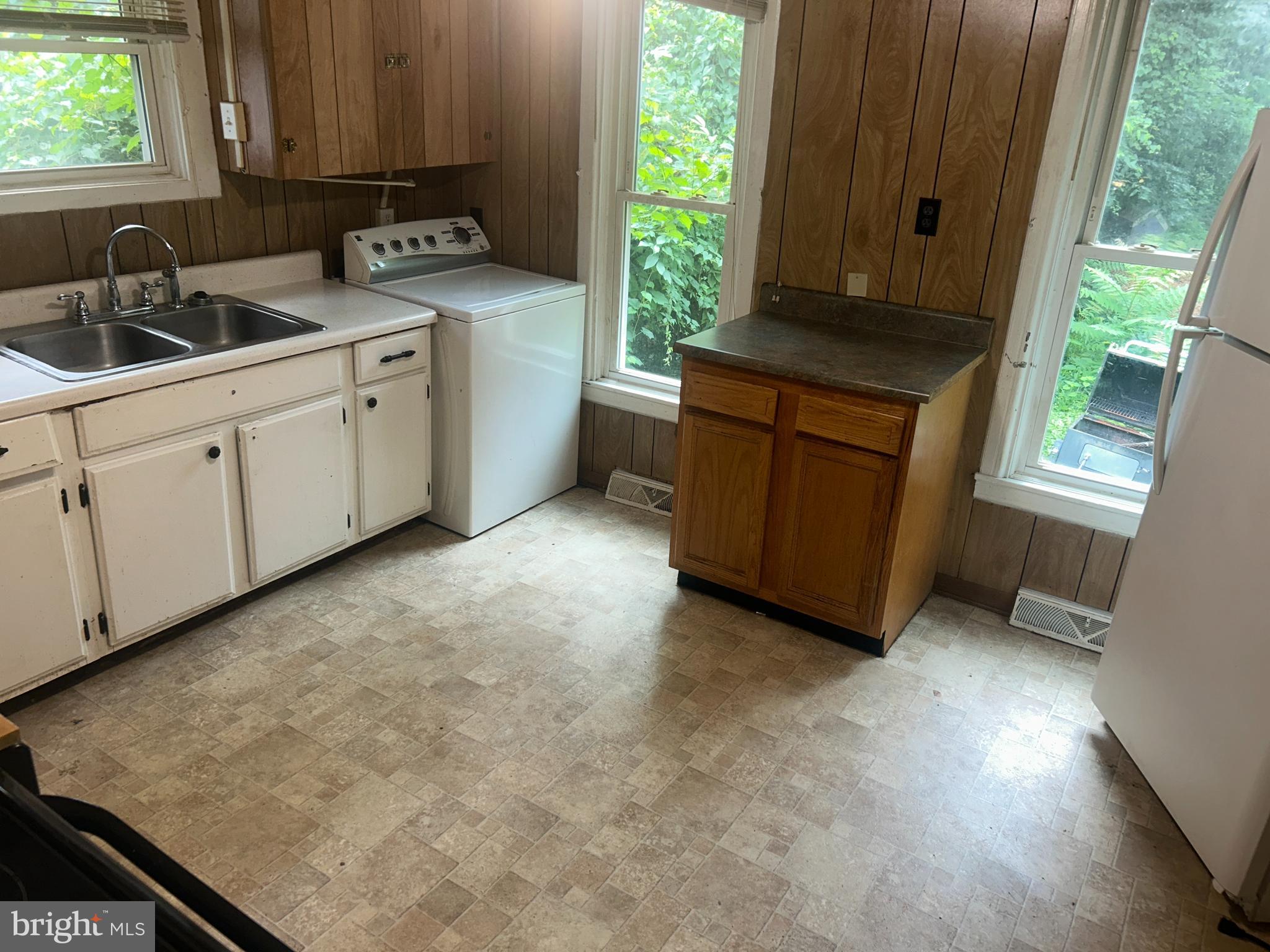 161 East Main Street Orange, VA 22960 - Photo 32 of 37 a kitchen with sink cabinets and window
