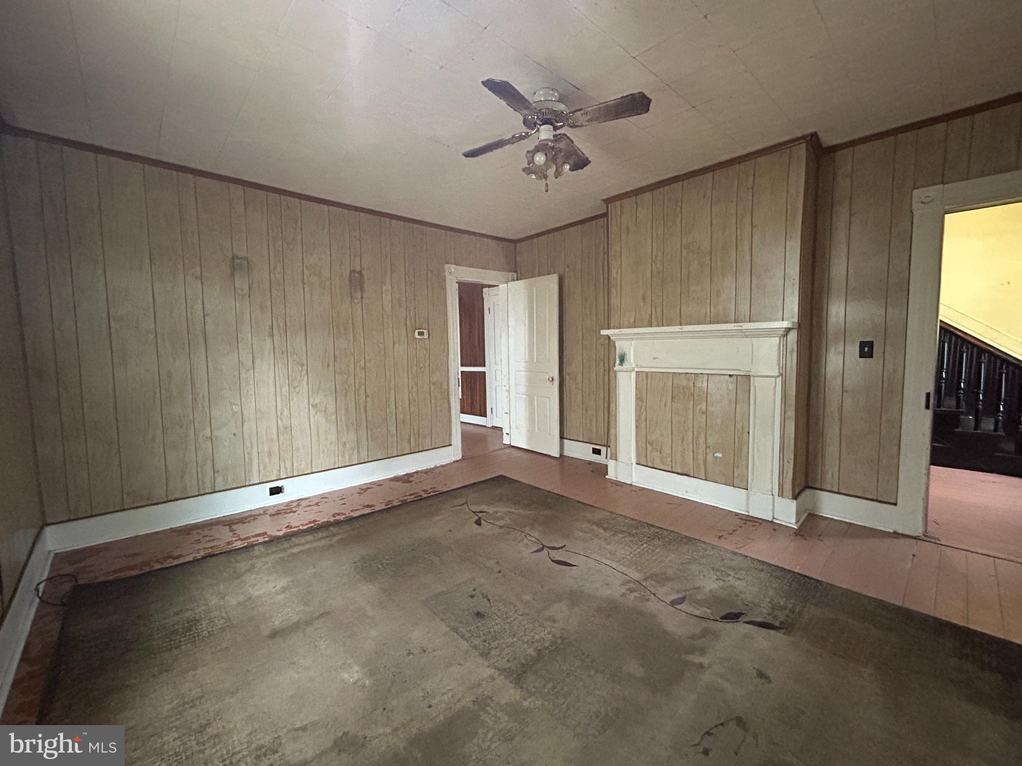 161 East Main Street Orange, VA 22960 - Photo 8 of 37 an empty room with windows and fireplace