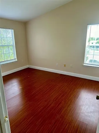 a kitchen with stainless steel appliances a sink a stove a refrigerator and cabinets
