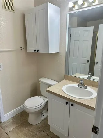 a bathroom with a sink a toilet and a bathtub