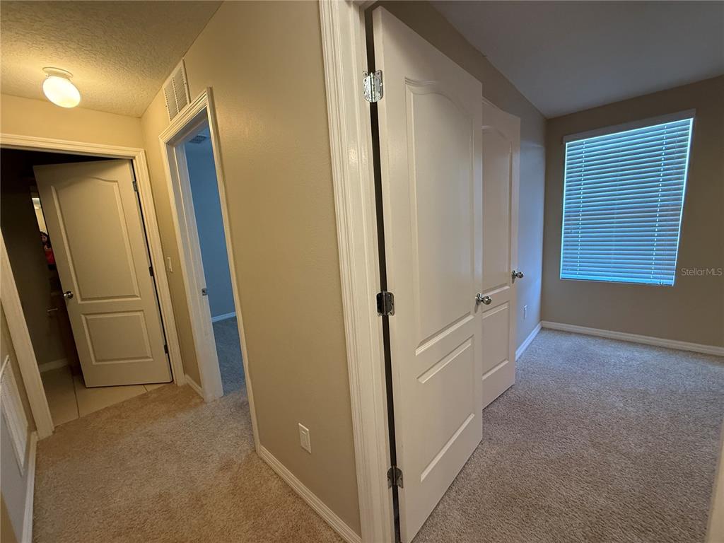 1623 Reflection Cove St. Cloud, FL 34771 - Photo 15 of 33 a view of hallway with hallway and door