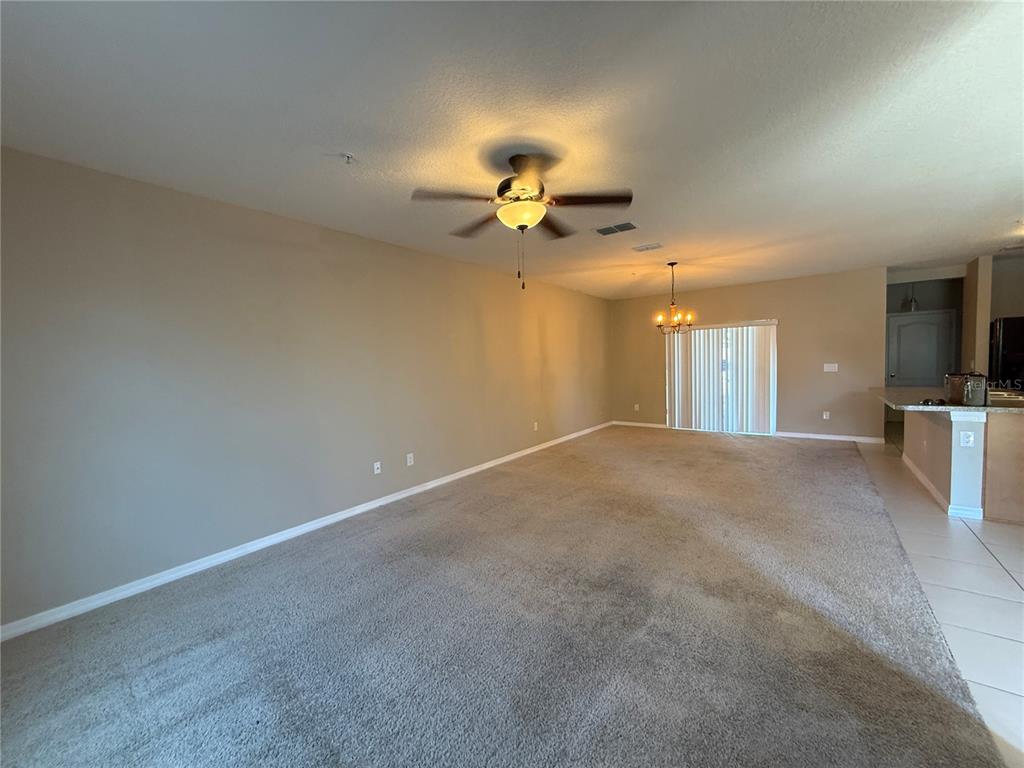 1623 Reflection Cove St. Cloud, FL 34771 - Photo 2 of 33 a view of a livingroom with a flat screen tv