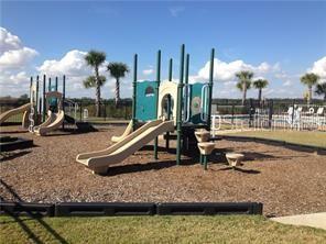 1623 Reflection Cove St. Cloud, FL 34771 - Photo 30 of 33 a view of a swimming pool with a patio