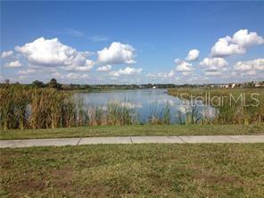 1623 Reflection Cove St. Cloud, FL 34771 - Photo 32 of 33 a view of a yard with a lake view