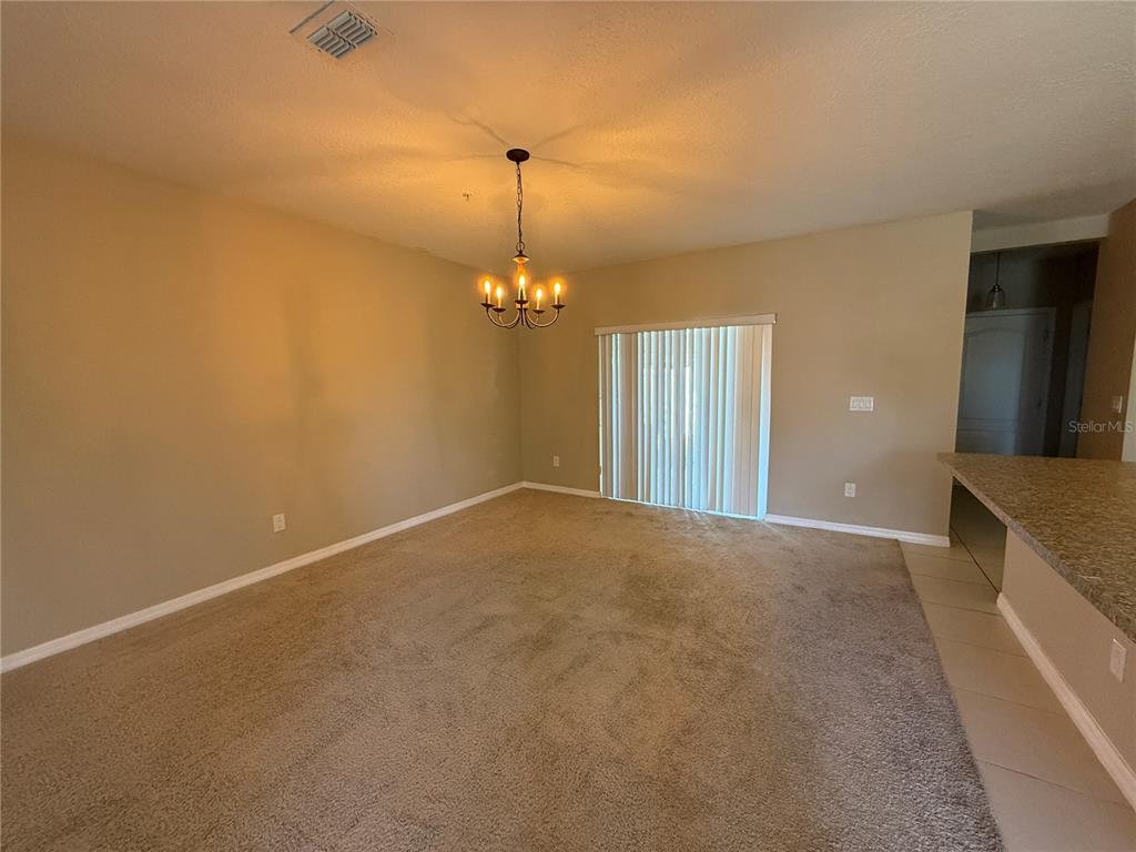 1623 Reflection Cove St. Cloud, FL 34771 - Photo 5 of 33 a view of a room with a chandelier