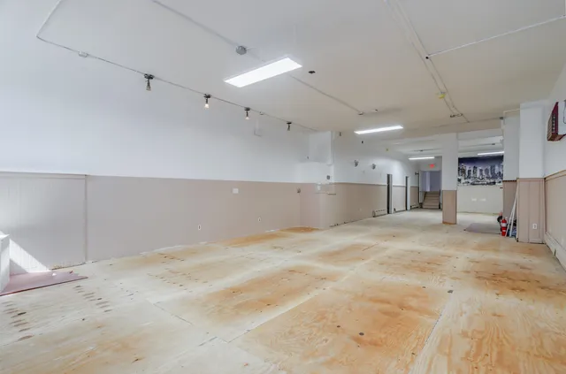 a view of kitchen and refrigerator