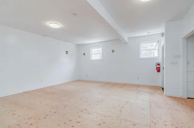 a kitchen with a refrigerator and a sink