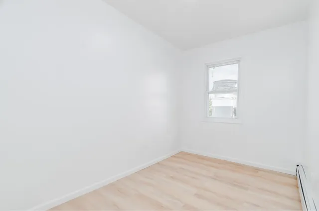 a view of a room that has a window in it