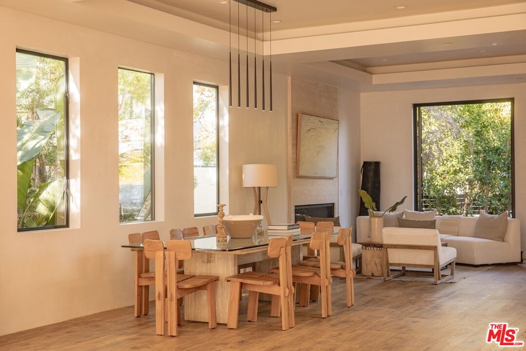 6546 Colgate Avenue Los Angeles, CA 90048 - Photo 15 of 42 a view of a dining room with furniture window and wooden floor