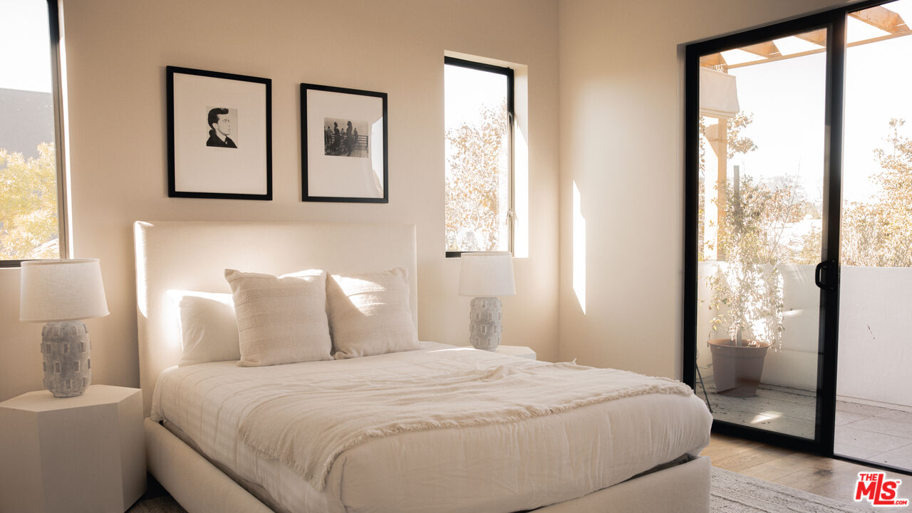 6546 Colgate Avenue Los Angeles, CA 90048 - Photo 26 of 42 a bedroom with a large bed and a window