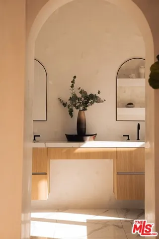 a bathroom with a sink and a mirror