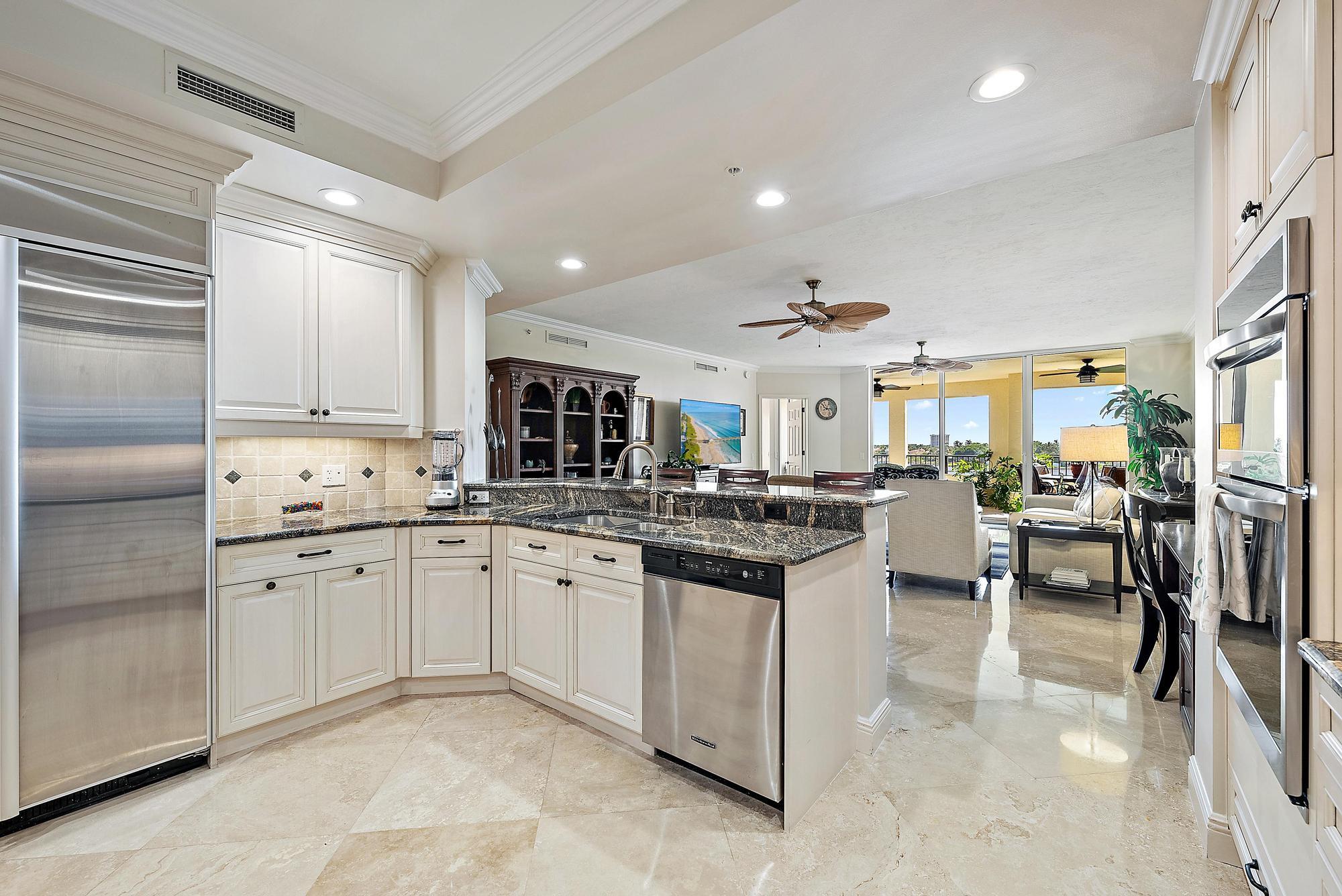 500 Highway 1, Unit 402 Jupiter, FL 33477 - Photo 16 of 37 a kitchen with counter space cabinets and appliances