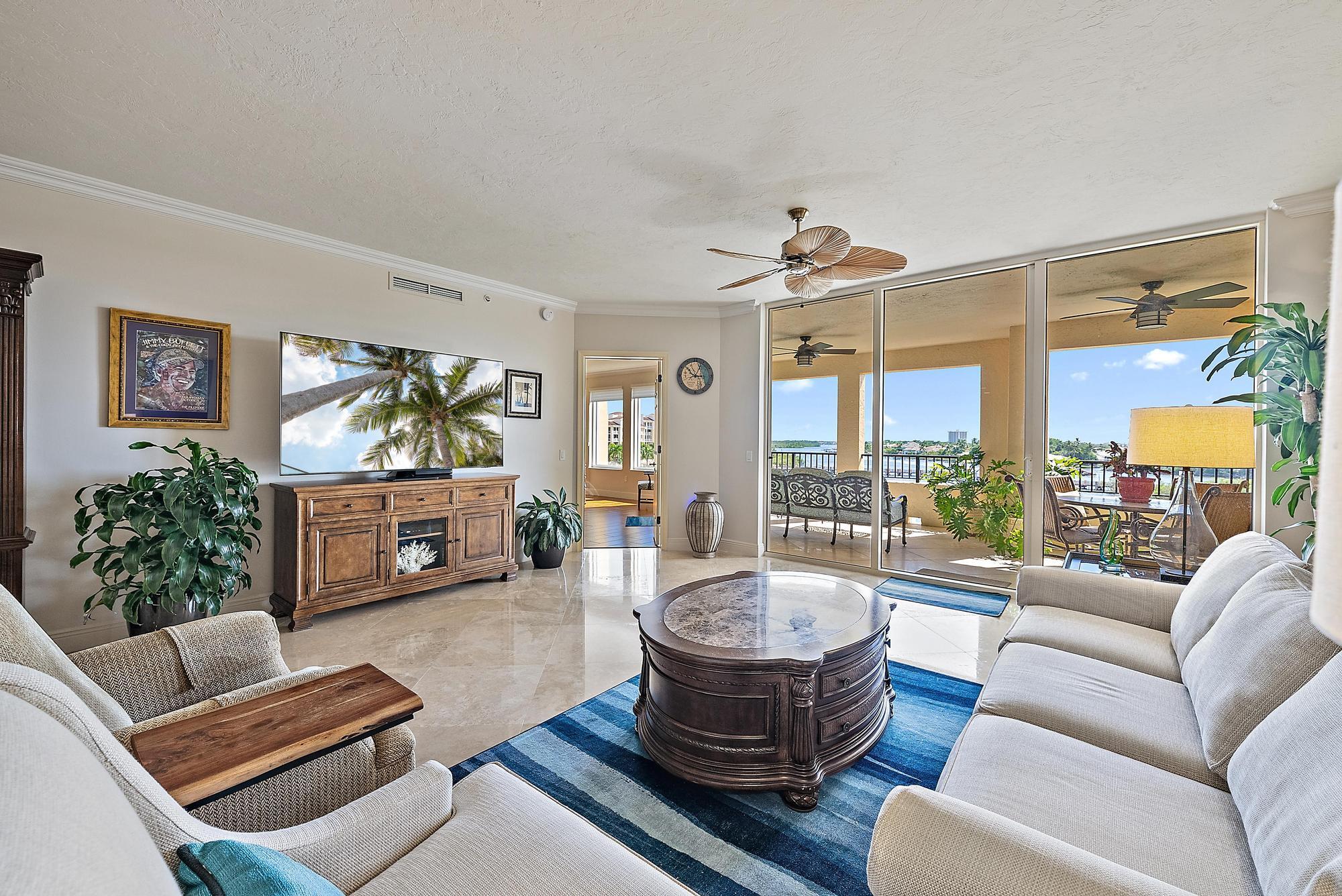 500 Highway 1, Unit 402 Jupiter, FL 33477 - Photo 2 of 37 a living room with furniture a rug and a large window