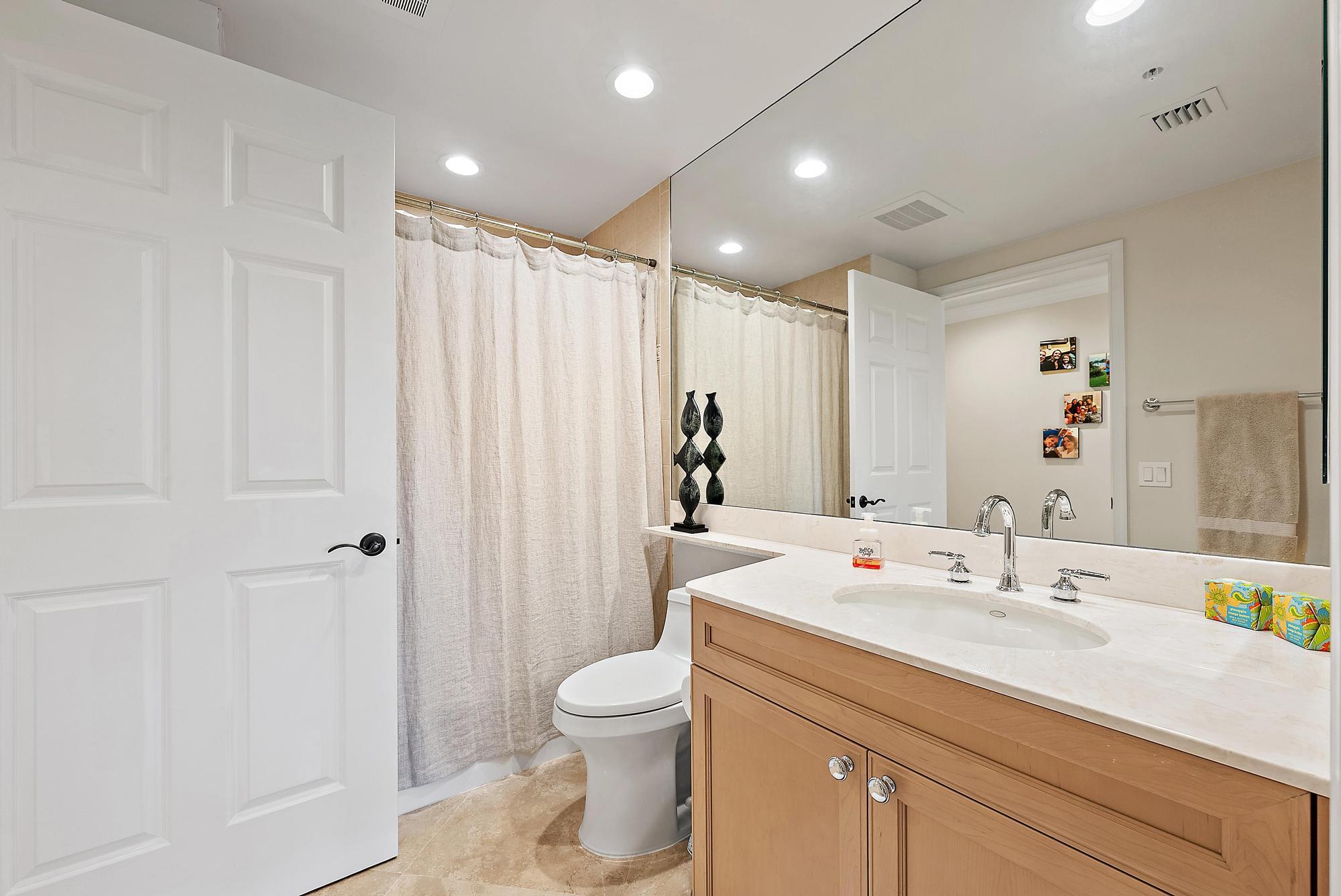 500 Highway 1, Unit 402 Jupiter, FL 33477 - Photo 24 of 37 a bathroom with a sink a toilet and shower