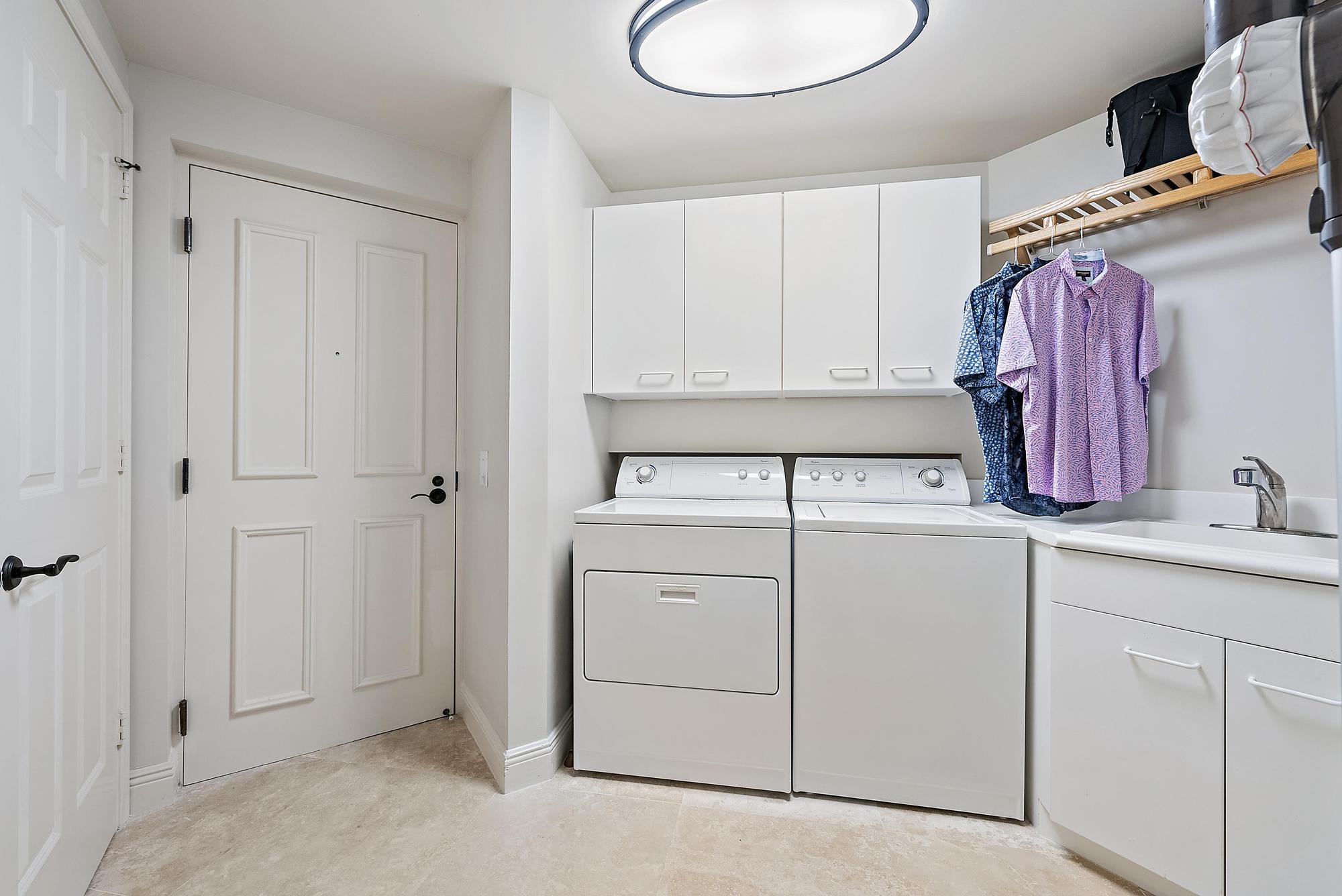 500 Highway 1, Unit 402 Jupiter, FL 33477 - Photo 25 of 37 a view of storage and utility room with two washing machine