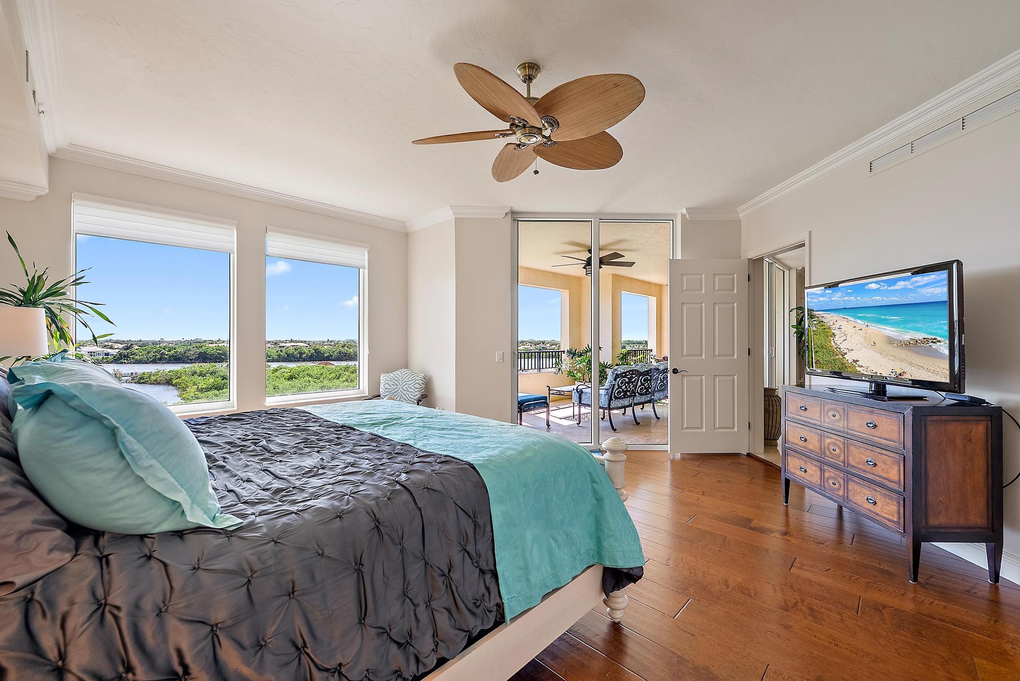 500 Highway 1, Unit 402 Jupiter, FL 33477 - Photo 5 of 37 a bedroom with a bed window and flat screen tv