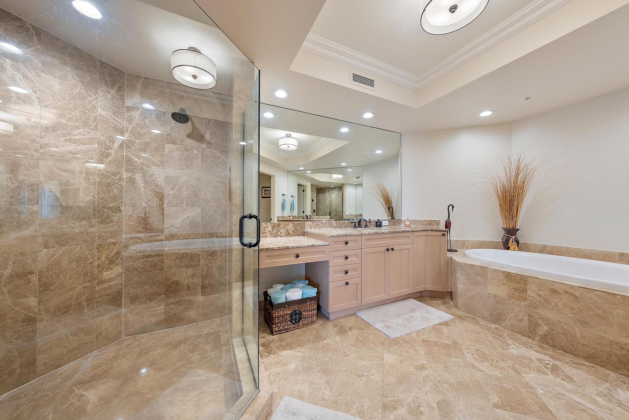 500 Highway 1, Unit 402 Jupiter, FL 33477 - Photo 7 of 37 a large white bathroom with a large tub sink shower and mirror