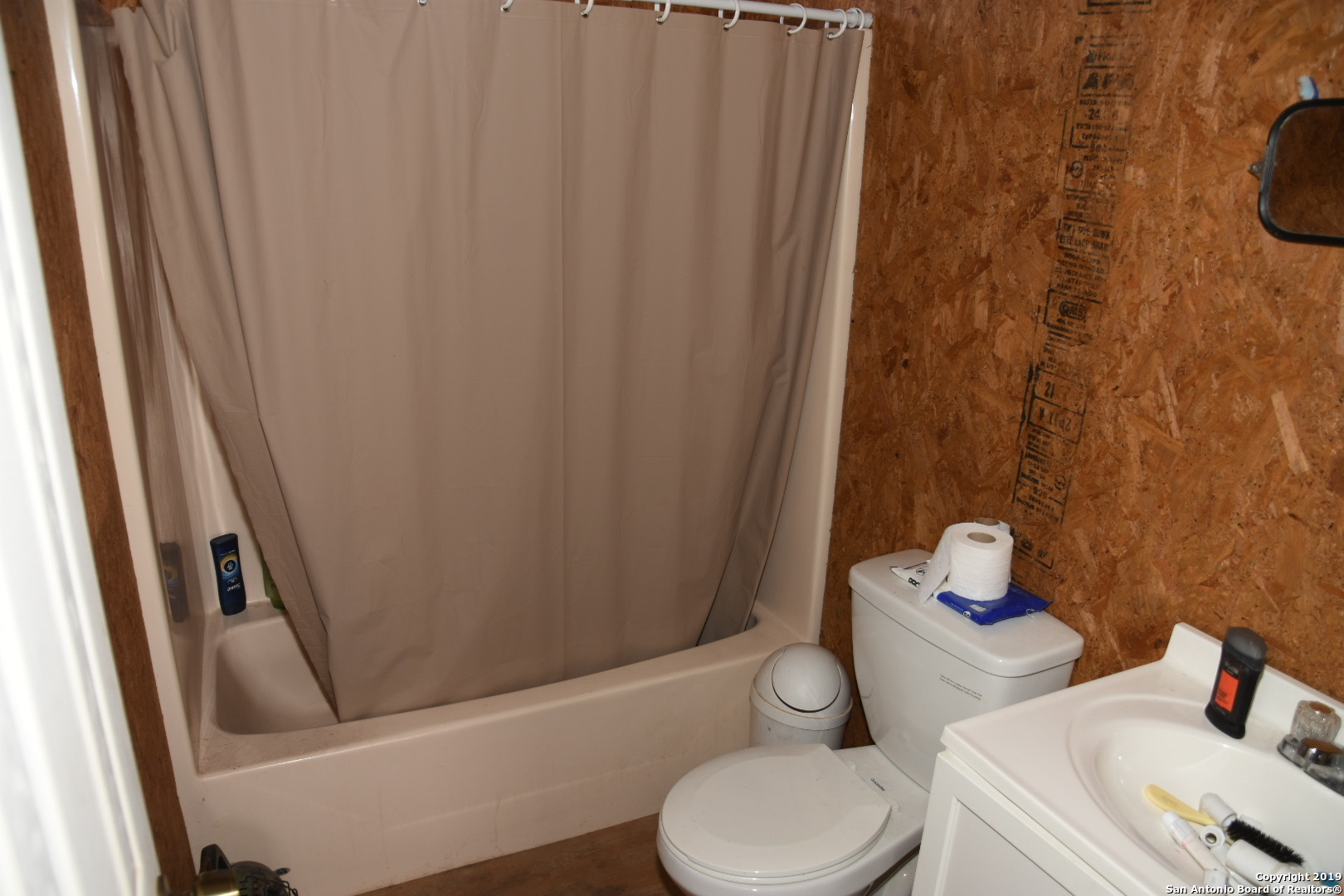 1052 Steep Road Del Rio, TX 78840 - Photo 18 of 25 a bathroom with a sink and toilet