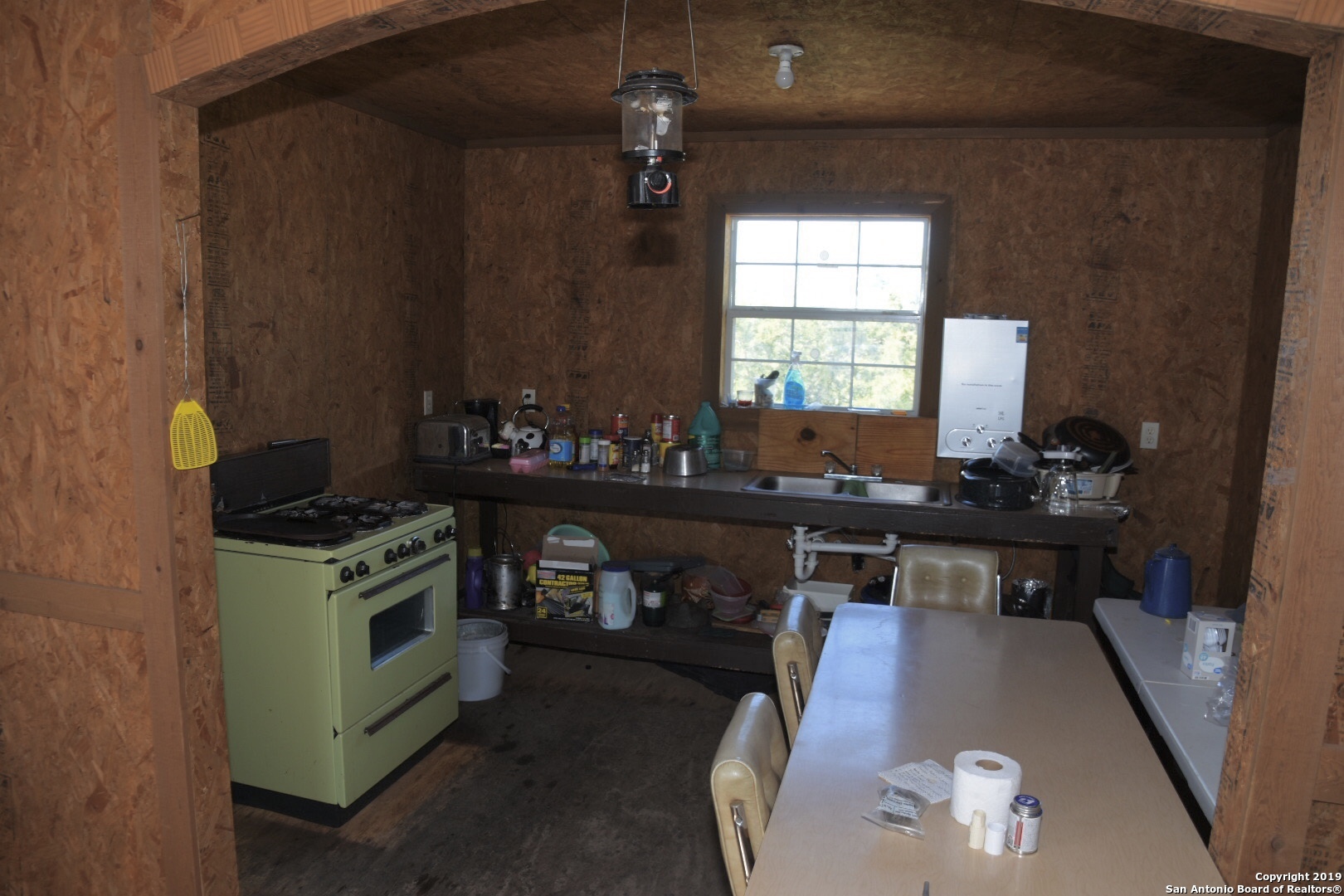 1052 Steep Road Del Rio, TX 78840 - Photo 23 of 25 a kitchen with a stove and a sink