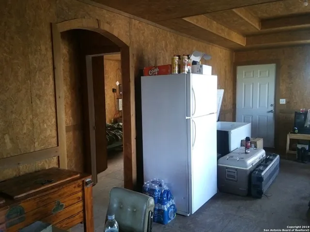 a room with furniture and a mirror