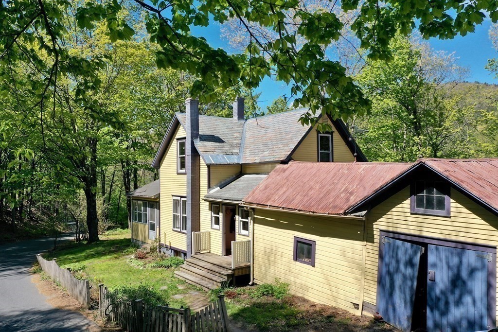 20 Frankton Road Shelburne, MA 01370 - Photo 5 of 41 a aerial view of a house with table and chairs under an umbrella