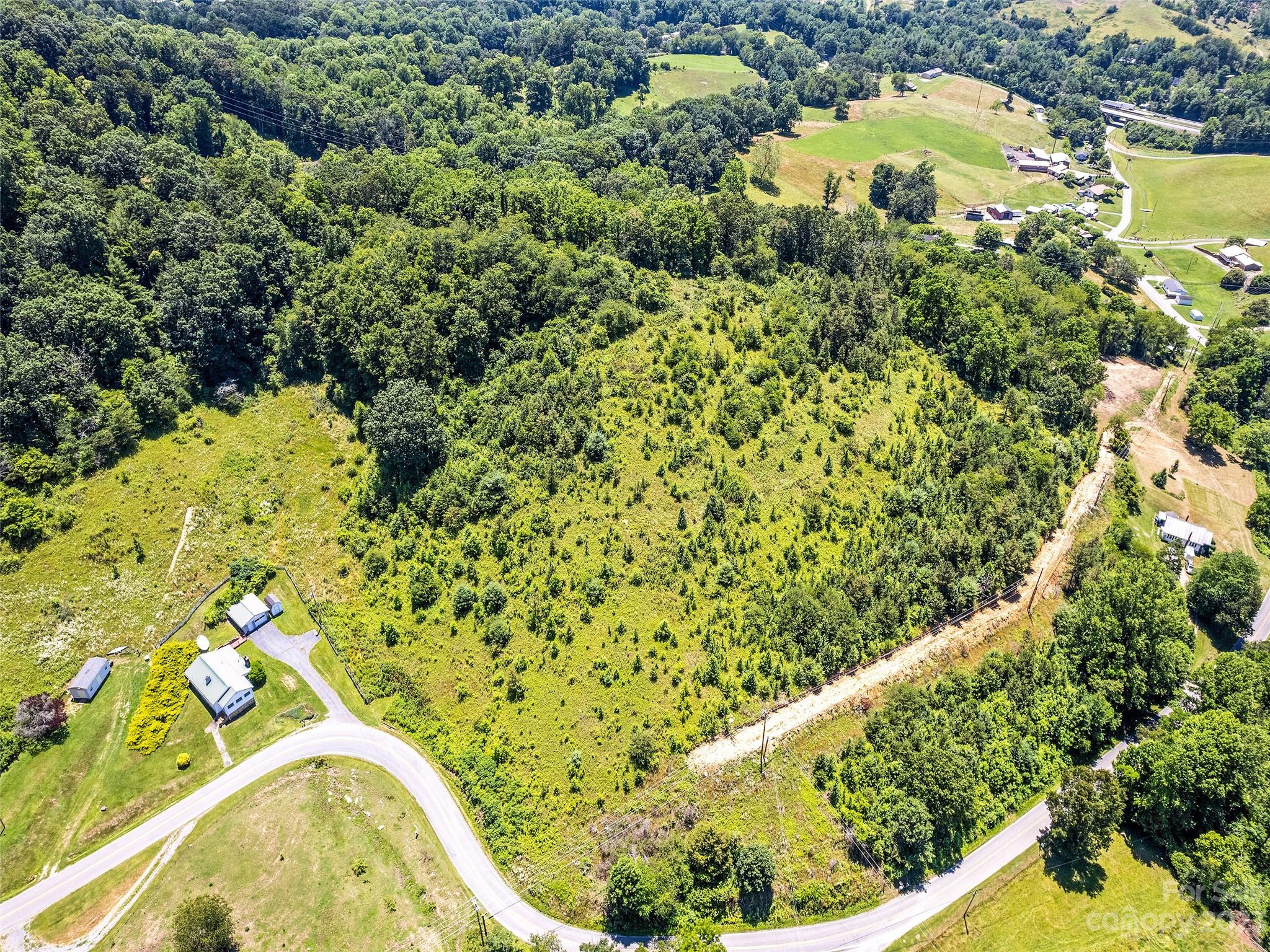 0 Hyder Mountain Road, Unit 6 Clyde, NC 28721 - Photo 1 of 11 a view of a garden with a house