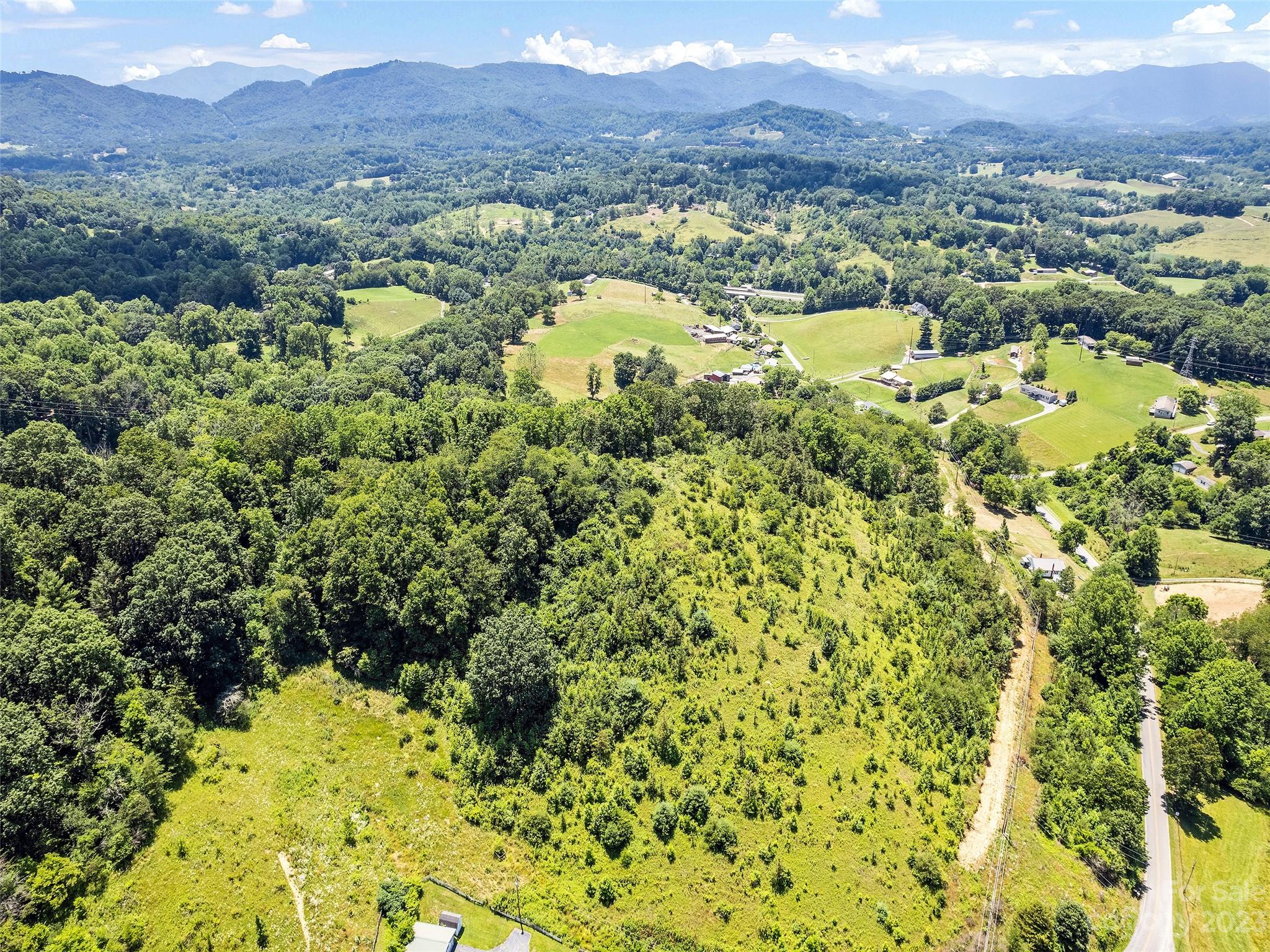 0 Hyder Mountain Road, Unit 6 Clyde, NC 28721 - Photo 6 of 11 a view of a lake with mountains in the background