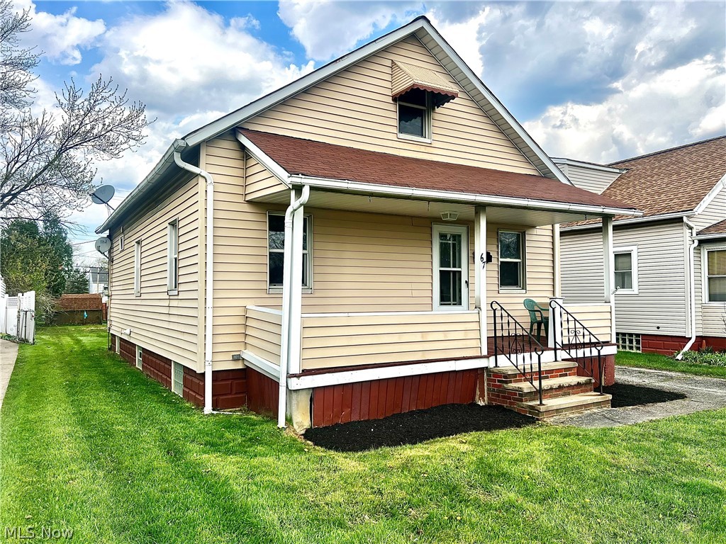 67 Forbes Road Bedford, OH 44146 - Photo 2 of 20 View of front of home with a front yard