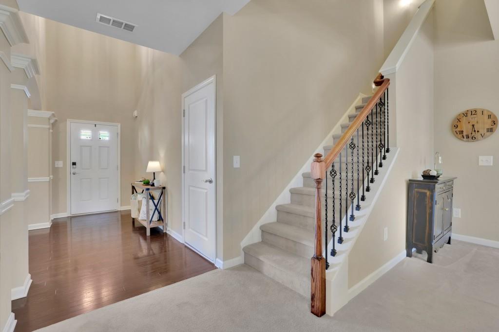 6130 Boulder Gate Way Cumming, GA 30028 - Photo 17 of 38 a view of a hallway view with staircase