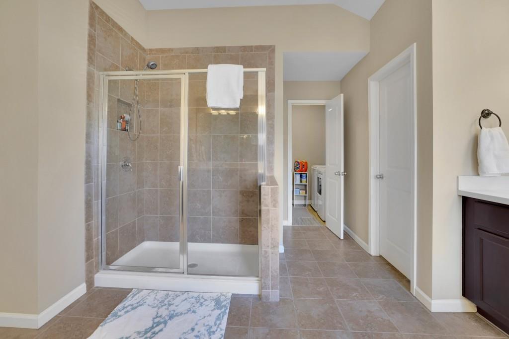 6130 Boulder Gate Way Cumming, GA 30028 - Photo 21 of 38 a bathroom with a shower