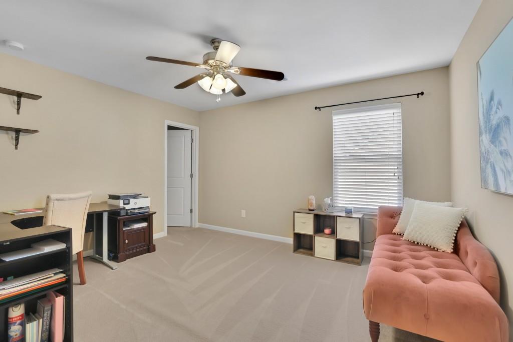 6130 Boulder Gate Way Cumming, GA 30028 - Photo 25 of 38 a bedroom with furniture and a window