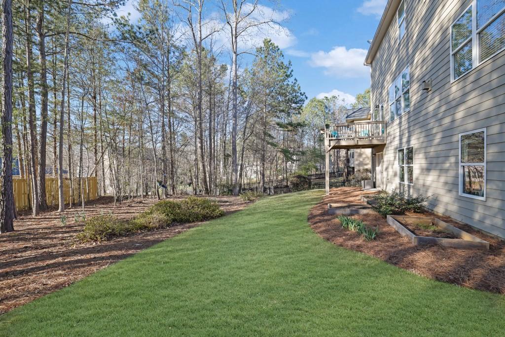 6130 Boulder Gate Way Cumming, GA 30028 - Photo 30 of 38 a view of a backyard with large trees