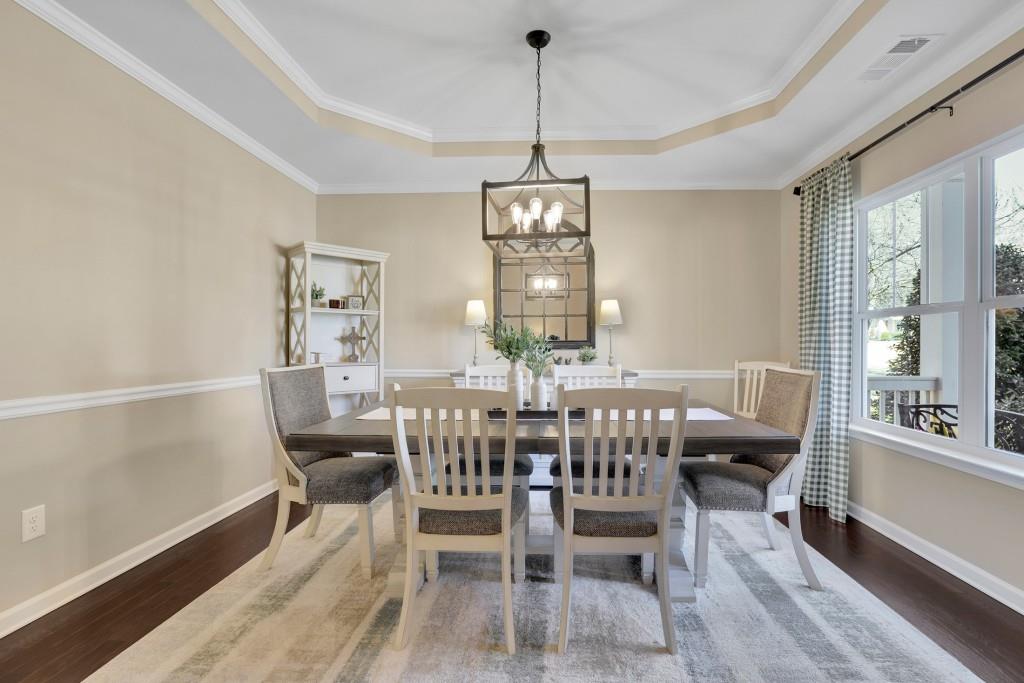 6130 Boulder Gate Way Cumming, GA 30028 - Photo 4 of 38 a view of a dining room with furniture window and outside view