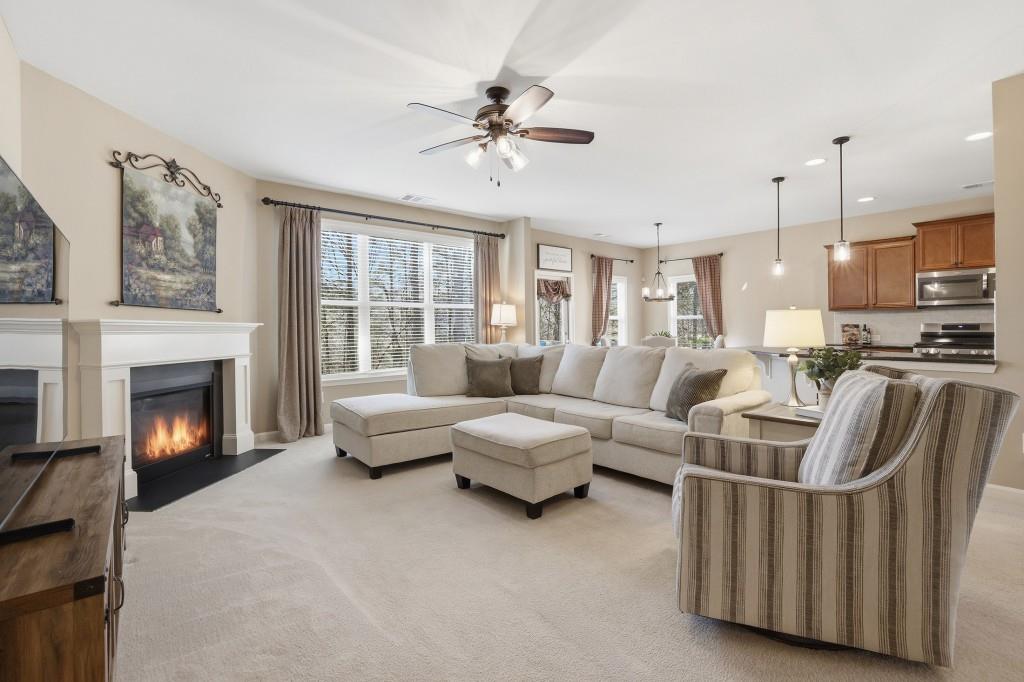 6130 Boulder Gate Way Cumming, GA 30028 - Photo 6 of 38 a living room with furniture and a fireplace