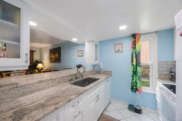 a kitchen with a sink and cabinets
