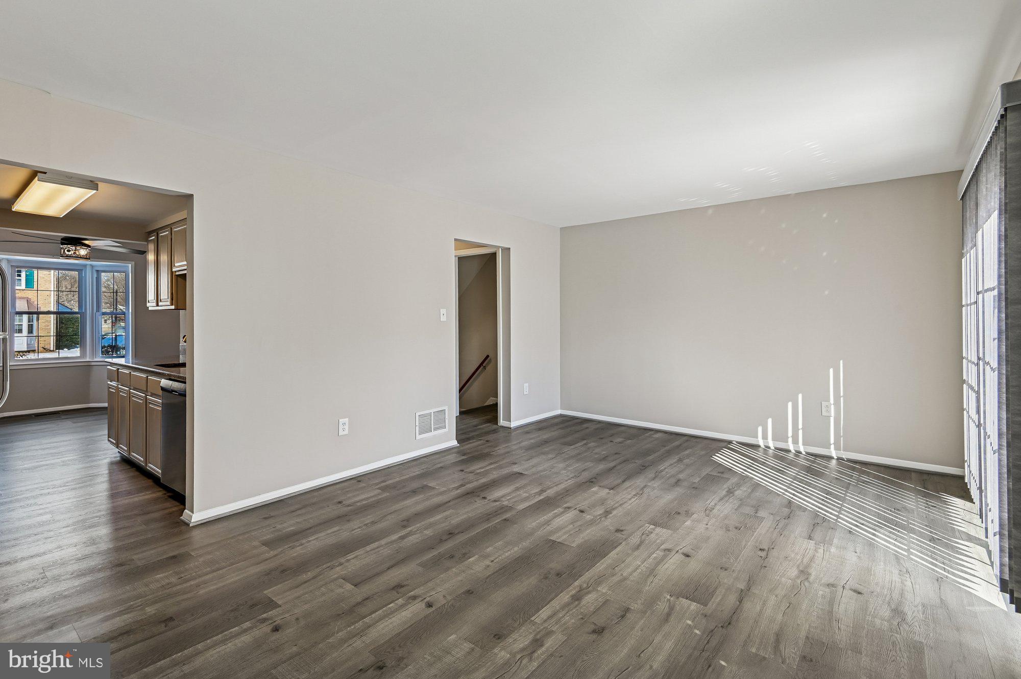 1753 Castleford Square Crofton, MD 21114 - Photo 14 of 30 a view of an empty room and wooden floor