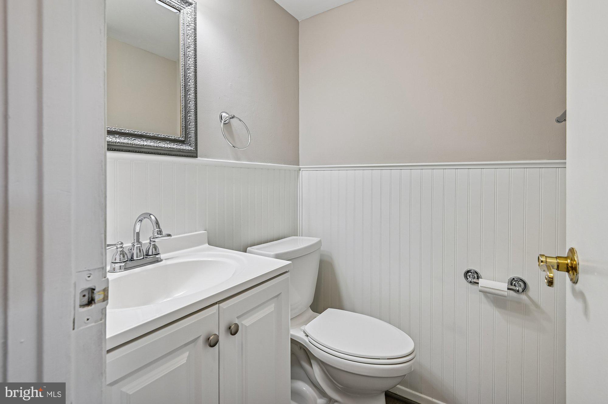 1753 Castleford Square Crofton, MD 21114 - Photo 15 of 30 a bathroom with a sink mirror vanity and toilet